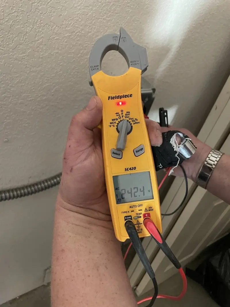 Voltage testing with clamp meter during Aluminum Wiring Replacement in Amity